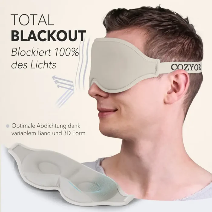 Schlafmaske und Ohrstöpsel für völlige Dunkelheit. Ein Mann trägt eine beige ergonomische Schlafmaske mit 3D-Form und verstellbarem Band. Die Maske schliesst das Licht vollständig aus und bietet hohen Tragekomfort.