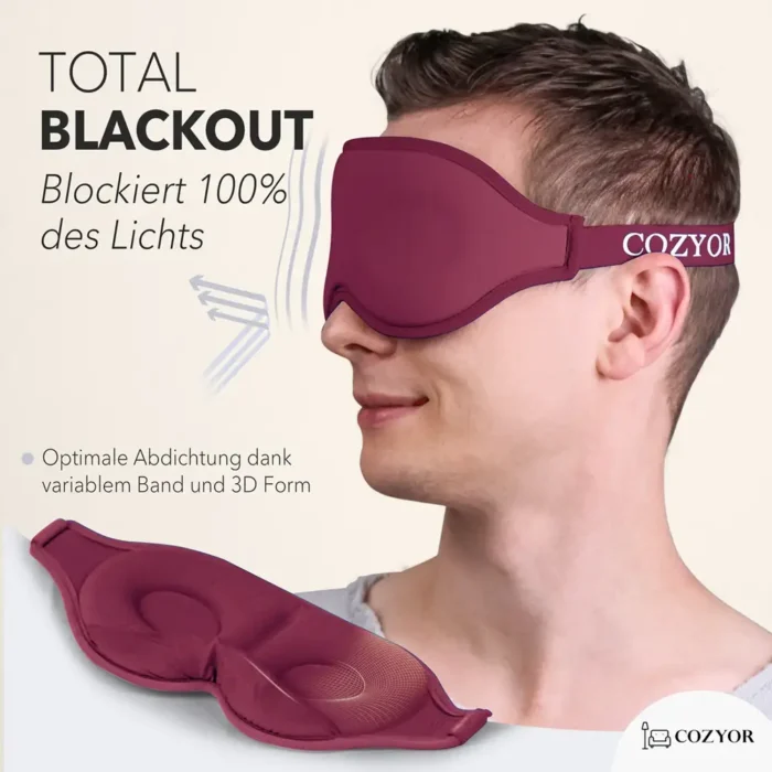 Schlafmaske und Ohrstöpsel für völlige Dunkelheit. Ein Mann trägt eine dunkelrote ergonomische Schlafmaske mit 3D-Form und verstellbarem Band. Die Maske schliesst das Licht vollständig aus und bietet hohen Tragekomfort.
